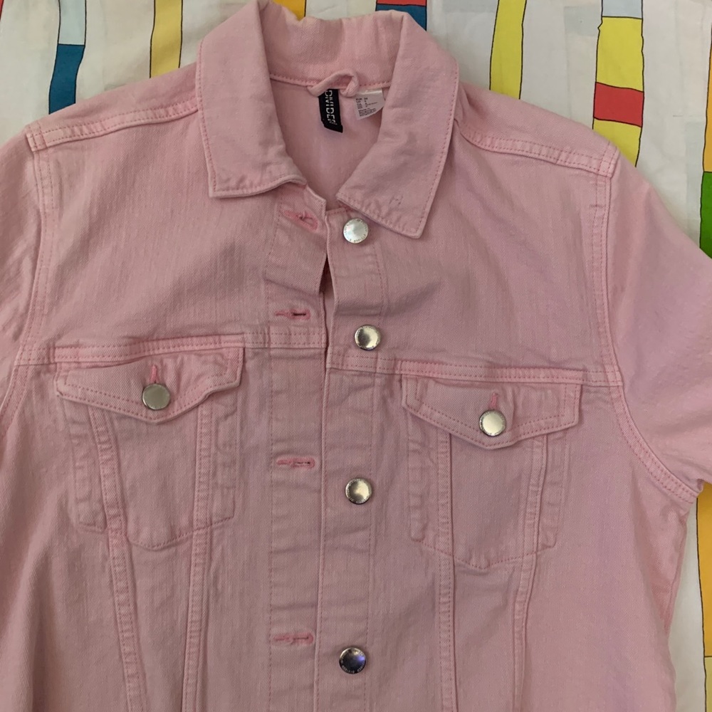 pink cropped denim jacket.